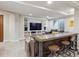 Finished basement with a TV, sofa and a bar at 9580 E 5Th Ave, Denver, CO 80230