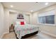 Cozy bedroom with a comfortable bed, neutral decor, and natural light at 9580 E 5Th Ave, Denver, CO 80230