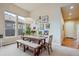 Dining room with modern art and a bench, bathed in natural light at 9580 E 5Th Ave, Denver, CO 80230