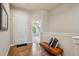 Inviting entryway with hardwood floors and convenient bench seating at 9580 E 5Th Ave, Denver, CO 80230