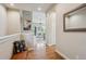 Stylish hallway with hardwood floors, leading to a bright and airy living space at 9580 E 5Th Ave, Denver, CO 80230