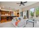 Inviting living room with a view into an updated kitchen and breakfast bar at 9580 E 5Th Ave, Denver, CO 80230