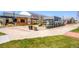 Landscaped outdoor commercial spaces with patios, planters and manicured landscaping at 9580 E 5Th Ave, Denver, CO 80230