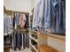 Spacious walk-in closet with organized shelves, hanging rods, and ample storage space at 9580 E 5Th Ave, Denver, CO 80230