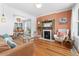 Inviting living room with fireplace and hardwood floors flows into dining area, perfect for entertaining guests at 3059 N Humboldt St, Denver, CO 80205