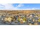 Expansive aerial view showcasing the home's neighborhood and proximity to local city at 9783 Zephyr Dr, Broomfield, CO 80021