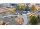 Aerial view of the home showcasing the roof, circular driveway, and mature trees at 9783 Zephyr Dr, Broomfield, CO 80021