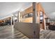 Upstairs bonus room with vinyl flooring, train decor, and view to a finished room with dark accent wall at 9783 Zephyr Dr, Broomfield, CO 80021