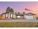 Charming home featuring shutters, front porch, and a well-manicured lawn at 9783 Zephyr Dr, Broomfield, CO 80021