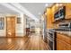 Kitchen featuring stainless steel appliances, ample natural light, and hardwood floors at 9783 Zephyr Dr, Broomfield, CO 80021