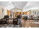 Bright and airy living room featuring hardwood floors and lots of natural light at 9783 Zephyr Dr, Broomfield, CO 80021