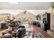 Spacious living room features vaulted ceilings, wood floors and light filled windows at 9783 Zephyr Dr, Broomfield, CO 80021