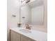 Clean bathroom with a white vanity, modern faucet, and a well-lit mirror at 3964 S Yosemite St, Denver, CO 80237