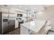 Bright kitchen with white cabinetry, stainless steel appliances, and a peninsula with seating at 3964 S Yosemite St, Denver, CO 80237