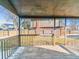 Back deck with view of fenced backyard at 7649 E Amherst Ave, Denver, CO 80231