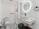 Modern basement bathroom with hexagon tile floor and floating vanity at 7649 E Amherst Ave, Denver, CO 80231