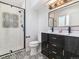 Stylish bathroom with double vanity and patterned tile at 7649 E Amherst Ave, Denver, CO 80231