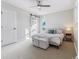 Main bedroom with plush bed and sliding barn door at 7649 E Amherst Ave, Denver, CO 80231