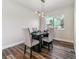 Dining room with dark wood table and four chairs, hardwood floors at 7649 E Amherst Ave, Denver, CO 80231