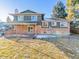 Back exterior view of house with deck and yard at 7649 E Amherst Ave, Denver, CO 80231