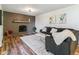 Living room with a fireplace, sectional sofa and large rug at 7649 E Amherst Ave, Denver, CO 80231