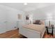 Bright bedroom with hardwood floors featuring closet and ample natural light at 4125 Pierce St, Wheat Ridge, CO 80033