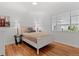 Spacious bedroom showcasing hardwood floors and abundant natural light at 4125 Pierce St, Wheat Ridge, CO 80033