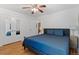 Charming bedroom featuring hardwood floors, a comfortable bed, and closet at 4125 Pierce St, Wheat Ridge, CO 80033
