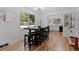 Open dining room with hardwood floors, large windows, and modern decor at 4125 Pierce St, Wheat Ridge, CO 80033