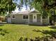Inviting home featuring a well-kept lawn and quaint front porch, perfect for relaxing at 4125 Pierce St, Wheat Ridge, CO 80033