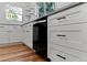 Updated kitchen showcasing white cabinets and modern hardware at 4125 Pierce St, Wheat Ridge, CO 80033