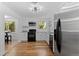 Modern kitchen featuring stainless steel appliances, white cabinets, and hardwood floors at 4125 Pierce St, Wheat Ridge, CO 80033