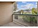Exterior shot of balcony with a view of carport and landscaping at 3847 Mossy Rock Dr # 104, Highlands Ranch, CO 80126