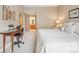 Cozy bedroom features soft neutral decor and workspace at 3847 Mossy Rock Dr # 104, Highlands Ranch, CO 80126