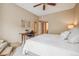 Cozy bedroom features soft neutral decor and workspace at 3847 Mossy Rock Dr # 104, Highlands Ranch, CO 80126