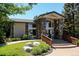 Impressive community clubhouse featuring stone pillars, ample windows, and a welcoming entrance at 3847 Mossy Rock Dr # 104, Highlands Ranch, CO 80126