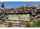 Attractive stone entrance sign for Canyon Ranch community, nestled among lush landscaping at 3847 Mossy Rock Dr # 104, Highlands Ranch, CO 80126