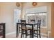 Eat-in dining area features natural light, neutral paint, and modern decor at 3847 Mossy Rock Dr # 104, Highlands Ranch, CO 80126