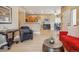 Open-concept living space with combined living, dining, and kitchen area, great for entertaining at 3847 Mossy Rock Dr # 104, Highlands Ranch, CO 80126