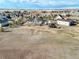 The aerial view shows a well-spaced rural residential area featuring the home and multiple outbuildings at 56450 E 40Th Ave, Strasburg, CO 80136