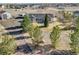 Expansive property featuring a charming ranch-style home, RV parking, outbuilding, and mature trees at 56450 E 40Th Ave, Strasburg, CO 80136