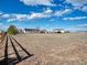 Wide-angle view of backyard, showing fence, house, outbuildings, and open land at 56450 E 40Th Ave, Strasburg, CO 80136