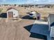Aerial view showcases the home, RV, outbuildings, and generous parking on a spacious lot at 56450 E 40Th Ave, Strasburg, CO 80136