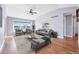 Spacious living room featuring high ceilings, a ceiling fan and large windows at 56450 E 40Th Ave, Strasburg, CO 80136