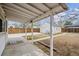 Covered patio in a fenced backyard with a detached garage at 4046 S Bannock St, Englewood, CO 80110