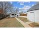 Backyard with a detached garage and a narrow strip of garden at 4046 S Bannock St, Englewood, CO 80110