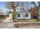 Curb view of a single-story home with a detached garage and well-maintained lawn at 4046 S Bannock St, Englewood, CO 80110