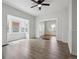 Bright living room features natural light, and leads to a large sunroom at 4046 S Bannock St, Englewood, CO 80110