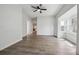 Bright living room with hardwood floors, a ceiling fan, and neutral paint tones at 4046 S Bannock St, Englewood, CO 80110