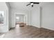 Bright living room with hardwood floors, a ceiling fan, and neutral paint tones at 4046 S Bannock St, Englewood, CO 80110